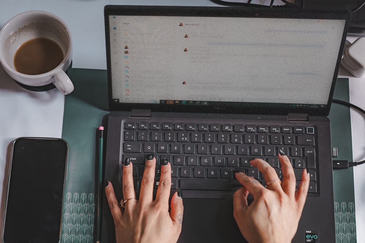 Flotation Energy team member working on a laptop in the office
