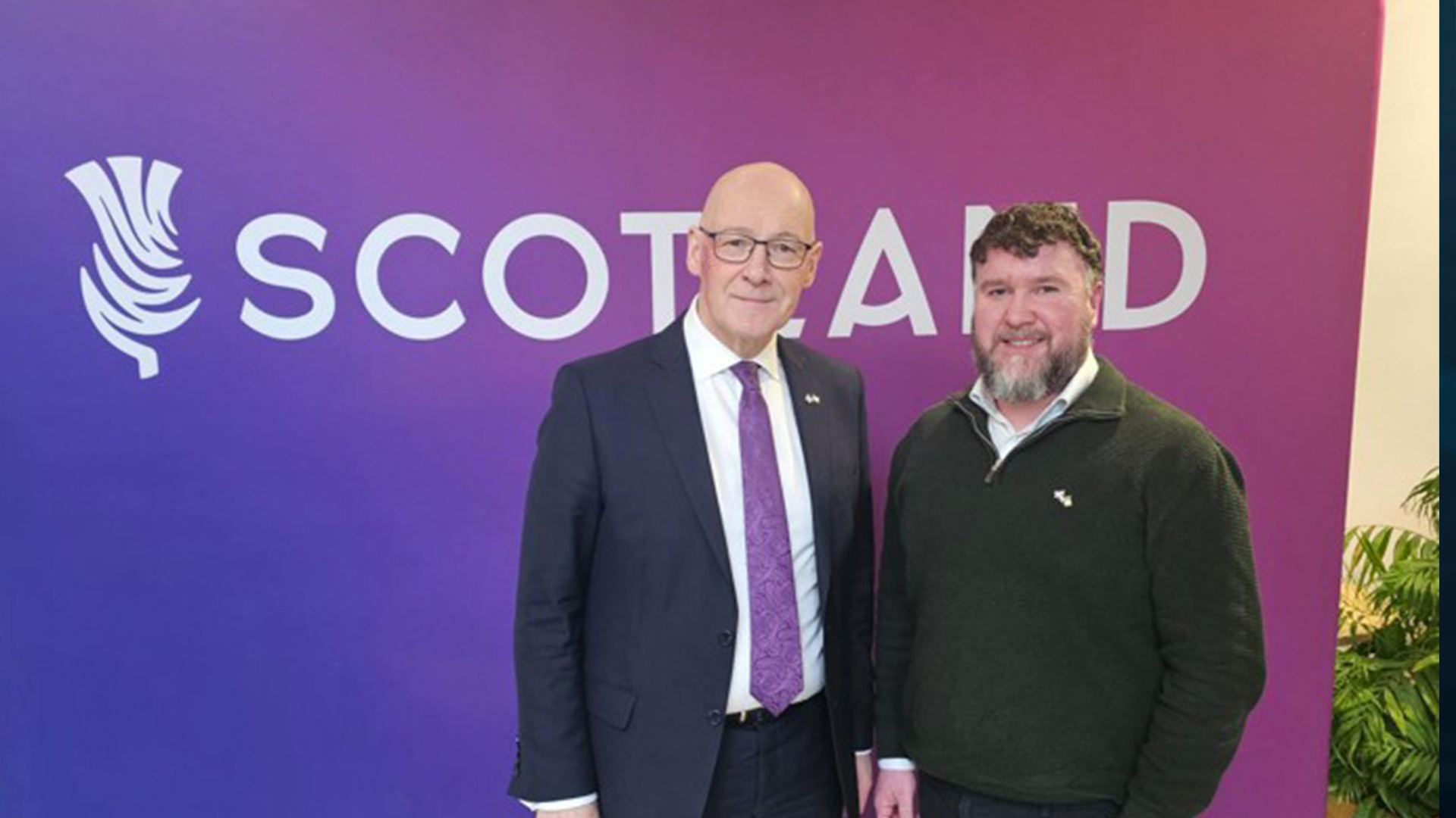 First Minister John Swinney with a Flotation Energy representative at a Scotland event